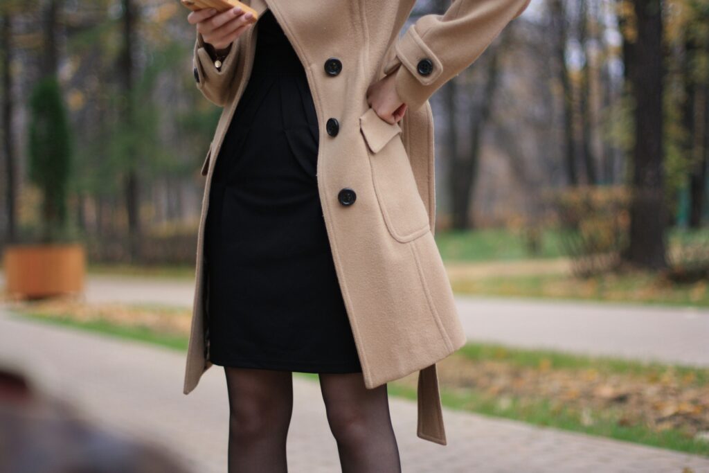 Woman in black sheath dress