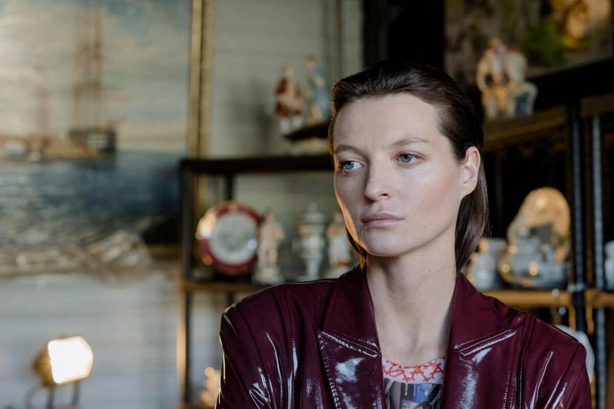 Woman wearing a burgundy leather blazer
