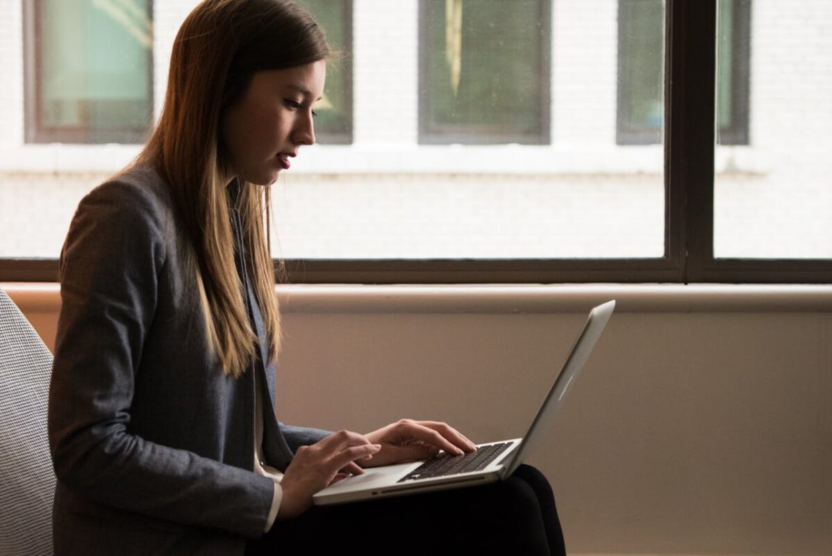 Woman typing on laptop