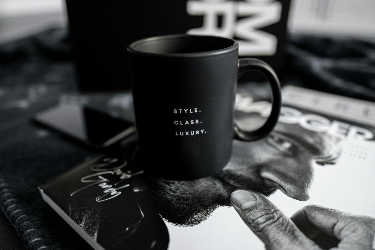 Black coffee mug with the words "Style. Class. Luxury."