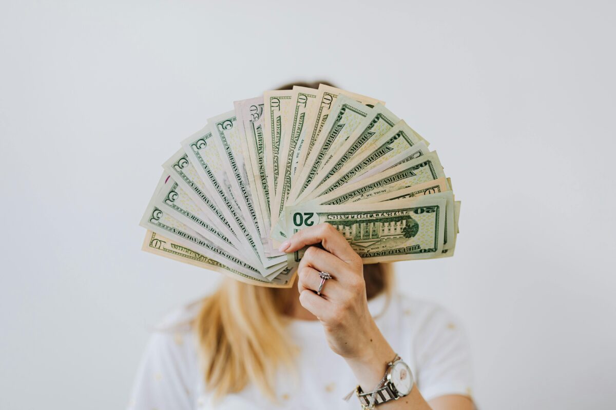 Woman holding a lot of money