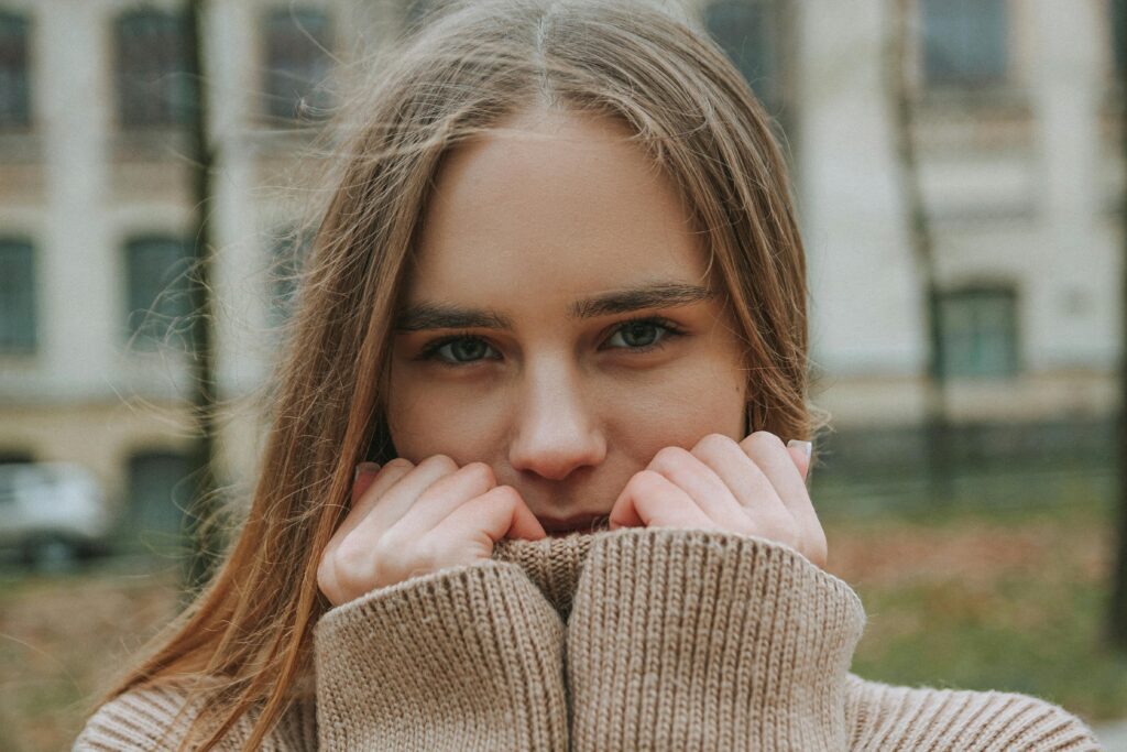 Woman wearing turtleneck sweater dress