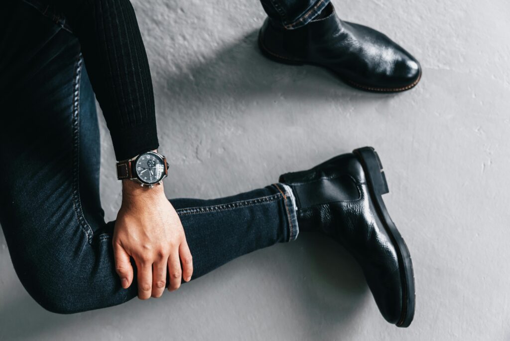 Woman wearing fashionable black ankle boots